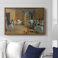The Dance Foyer at the Opera on the Rue Le Peletier, 1872 by Edgar Degas displayed above a sofa in a living room in a walnut floater frame, featuring an interior scene of dancers waiting and stretching in large studio.