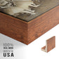 Close-up of the walnut floater frame corner and gallery wrapped canvas construction.