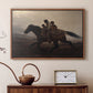 Walnut floater framed canvas featuring a narrative painting of escape and urgency across rugged terrain, displayed above a cabinet in a soft-toned living room.