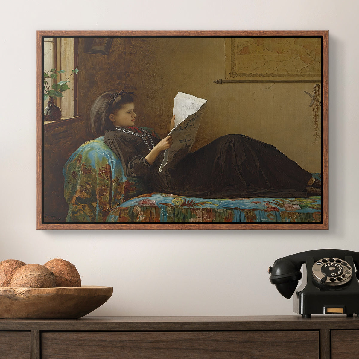 Interesting News, 1872 by Eastman Johnson in a walnut floater framed canvas displayed above a console table in a hallway, featuring a casual gathering around newspaper in rustic room.