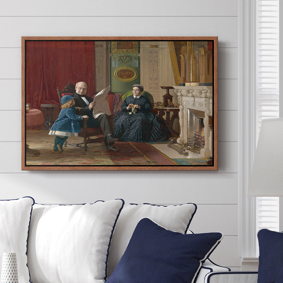 The Brown Family, 1869 by Eastman Johnson displayed above a sofa in a living room in a walnut floater frame, featuring a domestic portrait of group gathered in modest home setting.