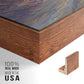 Close-up of the walnut floater frame corner and gallery wrapped canvas construction.
