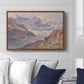 Odenwinklkees with the Johannisberg, 1902 by Edward Theodore Compton displayed above a sofa in a living room in a walnut floater frame, featuring a mountain scene with glacier stretching through rocky valley.