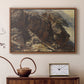 Walnut floater framed canvas featuring a high-altitude scene with rocky formations and sparse vegetation, displayed above a cabinet in a soft-toned living room.