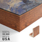 Close-up of the walnut floater frame corner and gallery wrapped canvas construction.