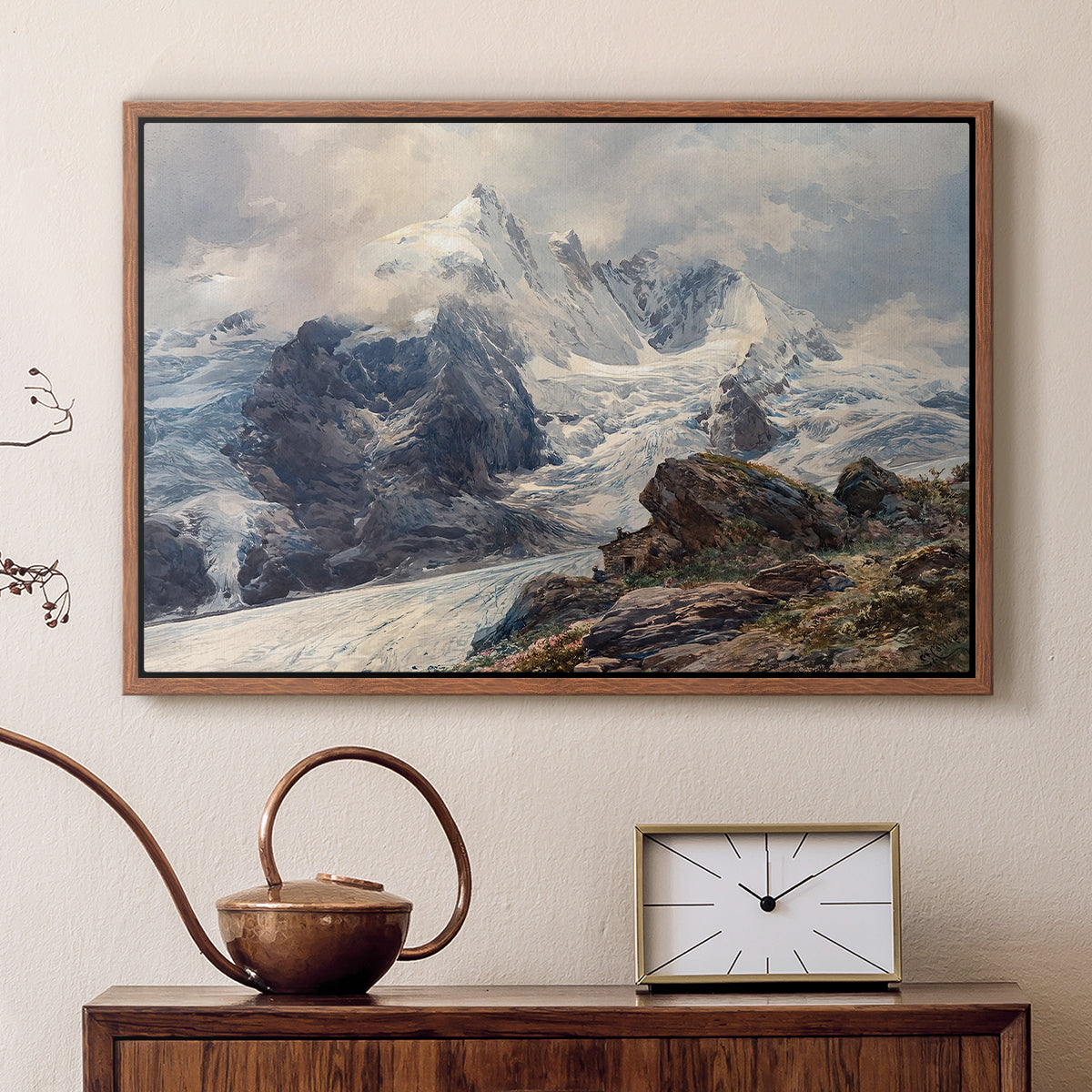 Walnut floater framed canvas featuring a realistic landscape of high mountain under open sky, displayed above a cabinet in a soft-toned living room.