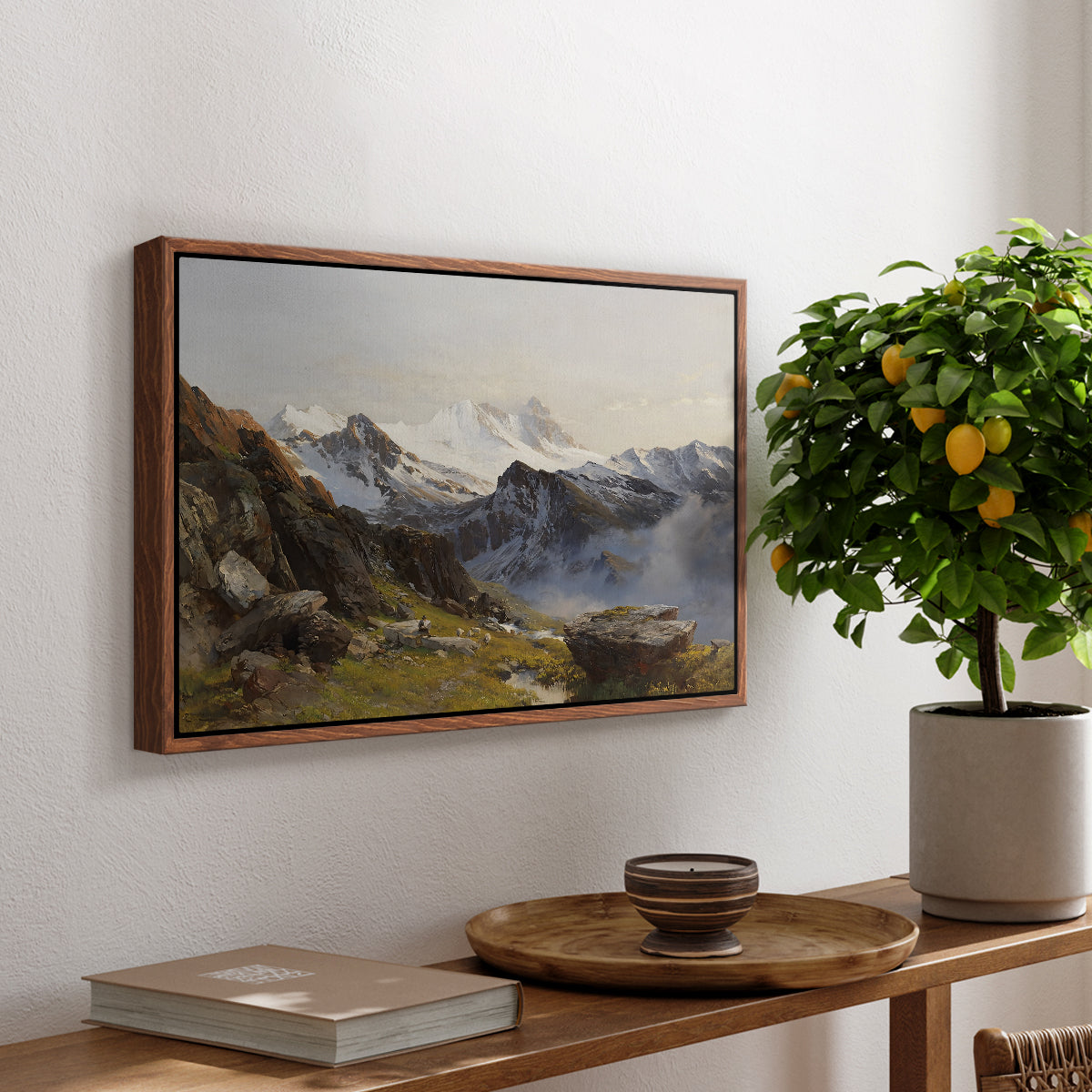 The Großglockner from the Prager Hut, 1890 by Edward Theodore Compton, presented in a walnut floater framed canvas featuring a view of Großglockner peak from alpine hut overlooking valley, displayed above a hallway console table.