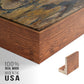 Close-up of the walnut floater frame corner and gallery wrapped canvas construction.