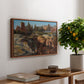 Palatine in Rome, c. 1921 by Edward Theodore Compton, presented in a walnut floater framed canvas featuring historic Roman ruins and buildings set within warm landscape, displayed above a hallway console table.