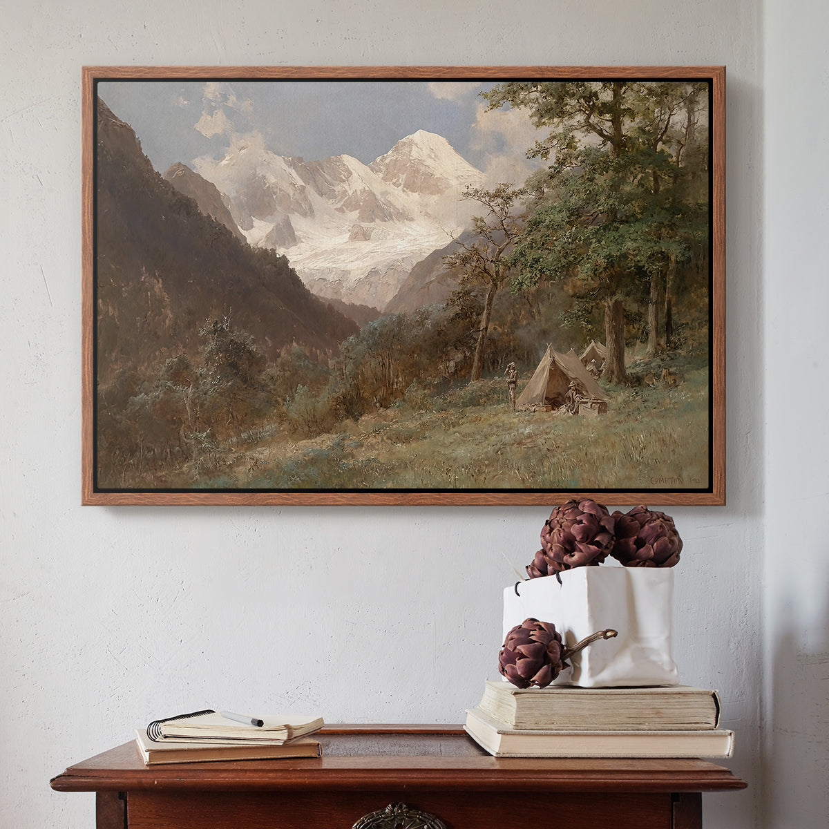 Walnut floater framed canvas featuring Landscape in the Caucasus, c. 1921 by Edward Theodore Compton above an entryway table in a minimalist foyer.
