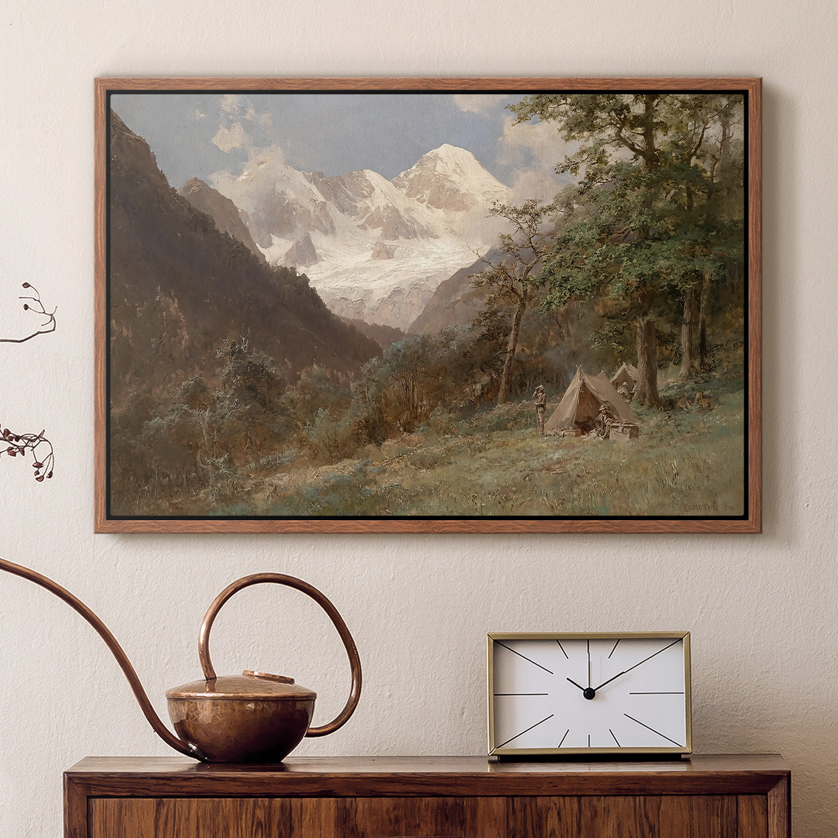 Walnut floater framed canvas featuring a natural scene with valleys and rocky formations, displayed above a cabinet in a soft-toned living room.