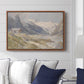 Shepherds (Pasterze), c. 1921 by Edward Theodore Compton displayed above a sofa in a living room in a walnut floater frame, featuring a pastoral mountain scene with figures tending livestock.