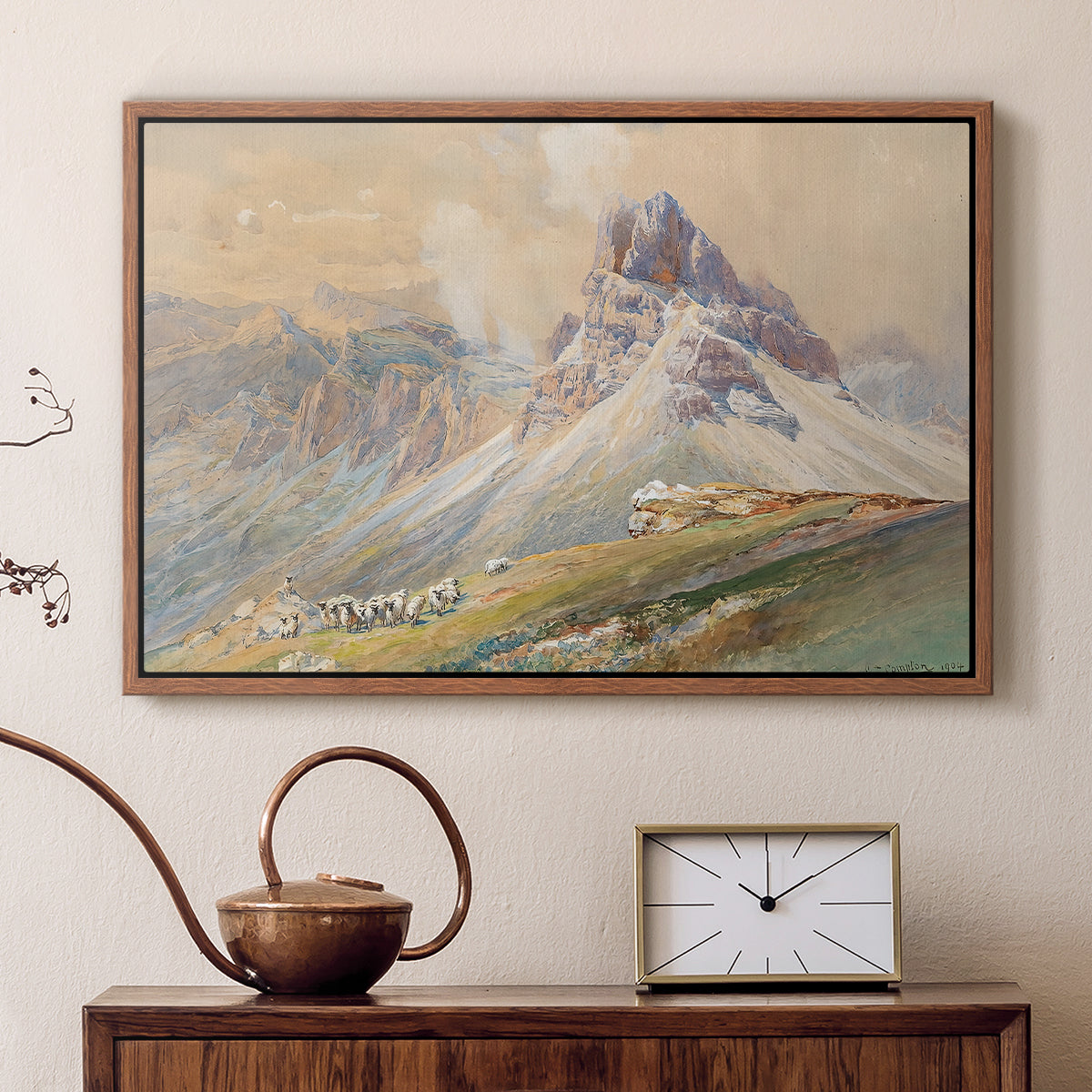 Walnut floater framed canvas featuring an expansive landscape featuring iconic Dolomite peaks, displayed above a cabinet in a soft-toned living room.