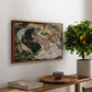 Death and the Maiden, 1915 by Egon Schiele, presented in a walnut floater framed canvas featuring intertwined figures representing death and woman in emotional embrace, displayed above a hallway console table.