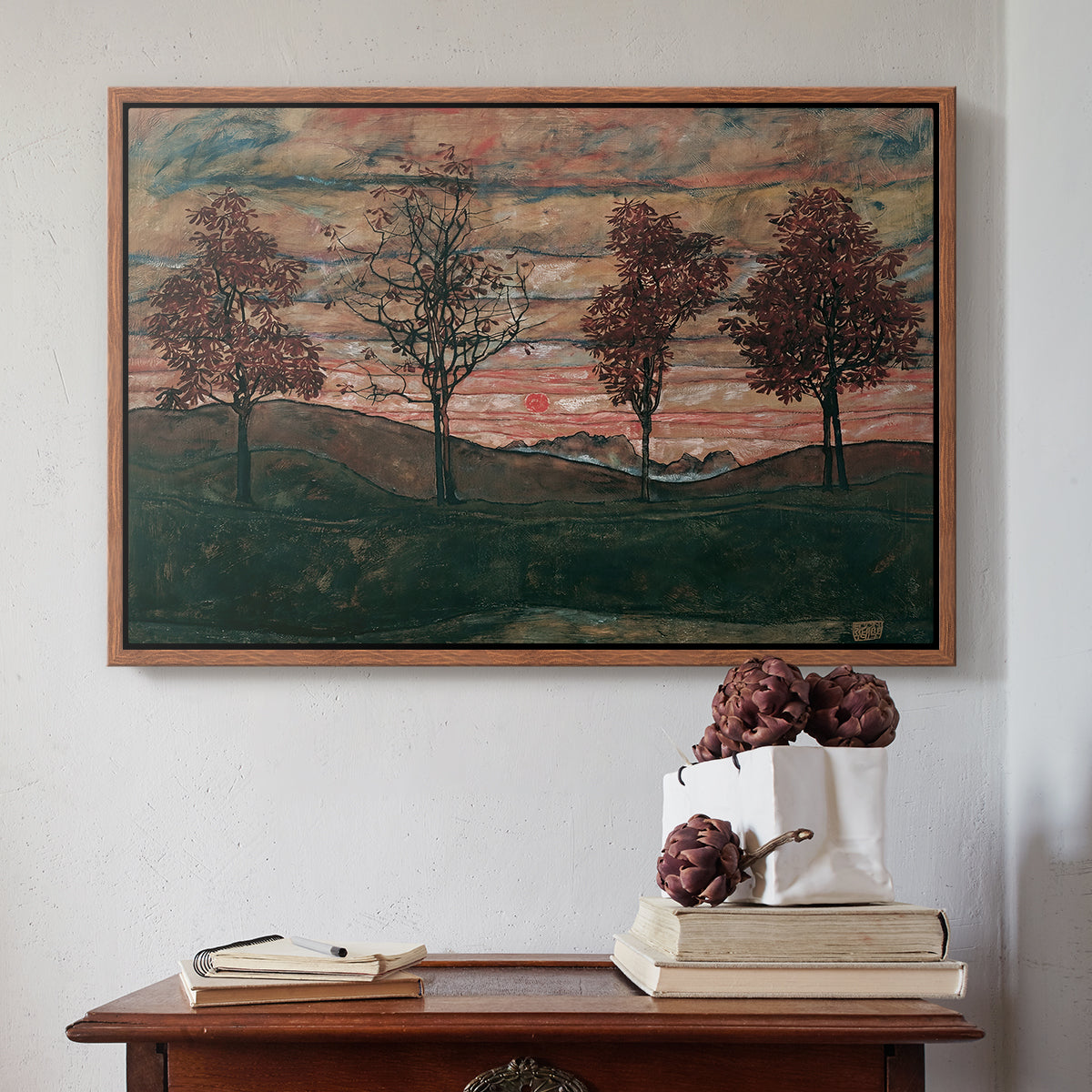 Walnut floater framed canvas featuring Four Trees, 1917 by Egon Schiele above an entryway table in a minimalist foyer.