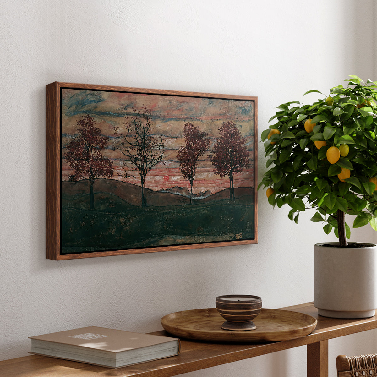 Four Trees, 1917 by Egon Schiele, presented in a walnut floater framed canvas featuring four trees standing in open landscape against colorful sky, displayed above a hallway console table.