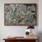 Walnut floater framed canvas featuring Mödling II, 1918 by Egon Schiele above an entryway table in a minimalist foyer.