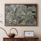 Walnut floater framed canvas featuring an abstracted town view with angular rooftops and fragmented forms, displayed above a cabinet in a soft-toned living room.