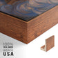 Close-up of the walnut floater frame corner and gallery wrapped canvas construction.