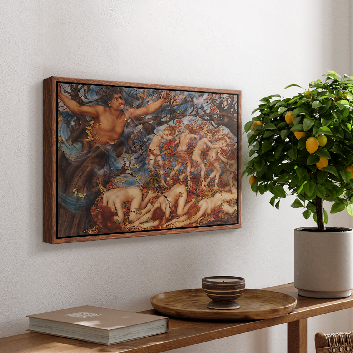 Boreas and the Fallen Leaves, c. 1910-1914 by Evelyn De Morgan, presented in a walnut floater framed canvas featuring swirling figures carried by wind among falling leaves in dynamic composition, displayed above a hallway console table.