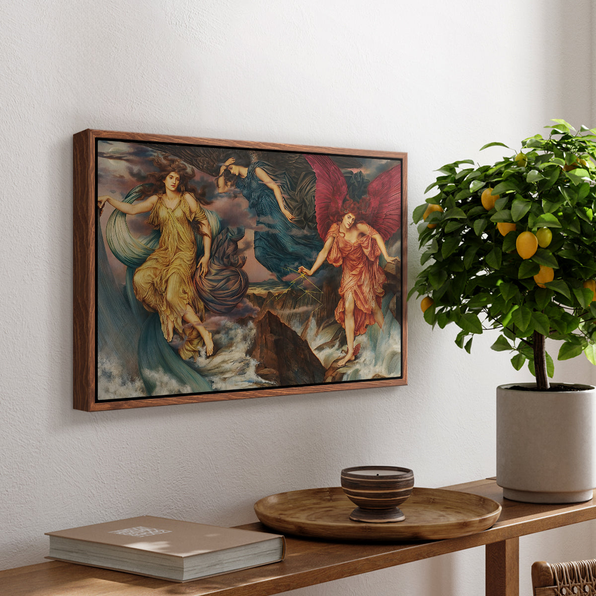 The Storm Spirits, 1900 by Evelyn De Morgan, presented in a walnut floater framed canvas featuring multiple figures swirling through sky representing storm forces in motion, displayed above a hallway console table.