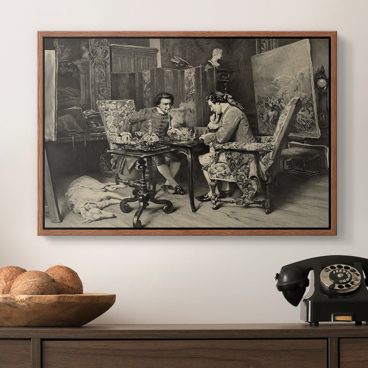 The Chess Players, 1858 by Ernest Meissonier in a walnut floater framed canvas displayed above a console table in a hallway, featuring a monochrome-style depiction of strategic game between two figures.