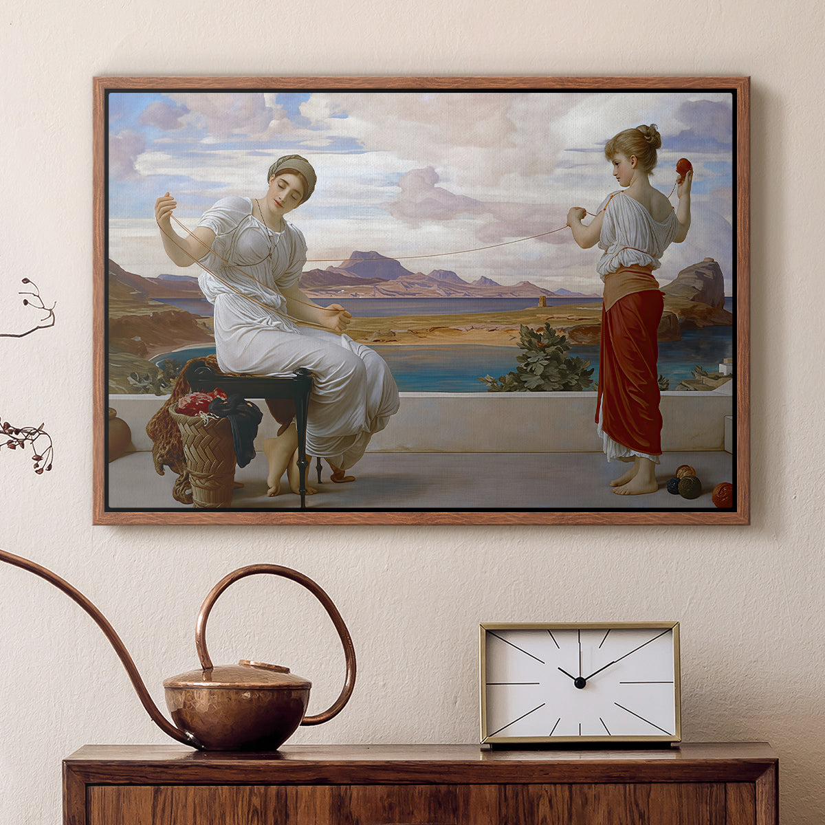 Walnut floater framed canvas featuring a classical scene of figures winding thread together, displayed above a cabinet in a soft-toned living room.