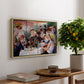 Luncheon of the Boating Party (Le Déjeuner des canotiers), 1880-1881 by Pierre-Auguste Renoir, presented in a natural wood floater framed canvas featuring a group of elegantly dressed people dining together on a sunlit balcony overlooking the river, displayed above a hallway console table.