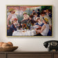 Luncheon of the Boating Party (Le Déjeuner des canotiers), 1880-1881 by Pierre-Auguste Renoir in a natural wood floater framed canvas displayed above a console table in a hallway, featuring a social dining scene with figures seated around table on riverside terrace.