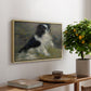 Tama, the Japanese Dog, c. 1876 by Pierre-Auguste Renoir, presented in a natural wood floater framed canvas featuring a small black and white dog standing in shallow water with soft brushstrokes, displayed above a hallway console table.