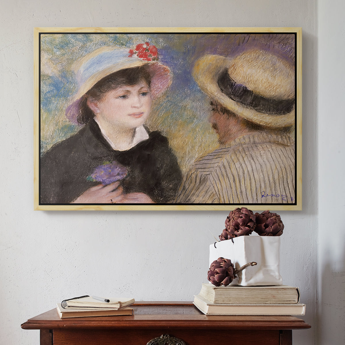 Natural wood floater framed canvas featuring Boating Couple (Aline Charigot and Renoir), c. 1881 by Pierre-Auguste Renoir above an entryway table in a minimalist foyer.