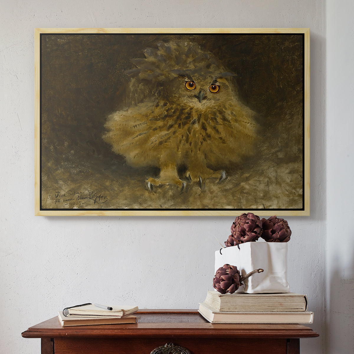 Natural wood floater framed canvas featuring An Eagle Owl (Berguv), 1905 by Bruno Liljefors above an entryway table in a minimalist foyer.