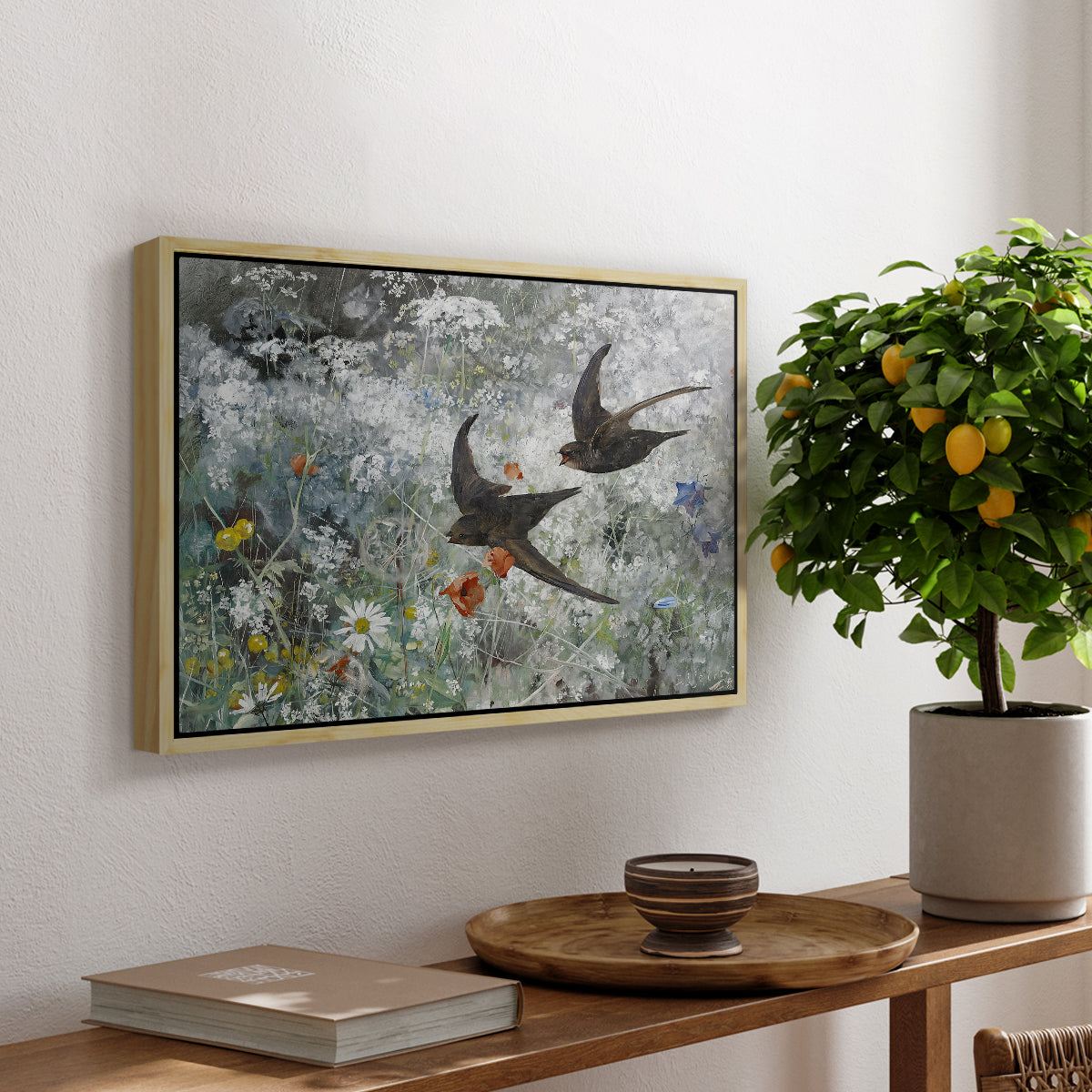 Common Swifts, 1886 by Bruno Liljefors, presented in a natural wood floater framed canvas featuring a flock of birds in flight soaring across open sky above landscape, displayed above a hallway console table.