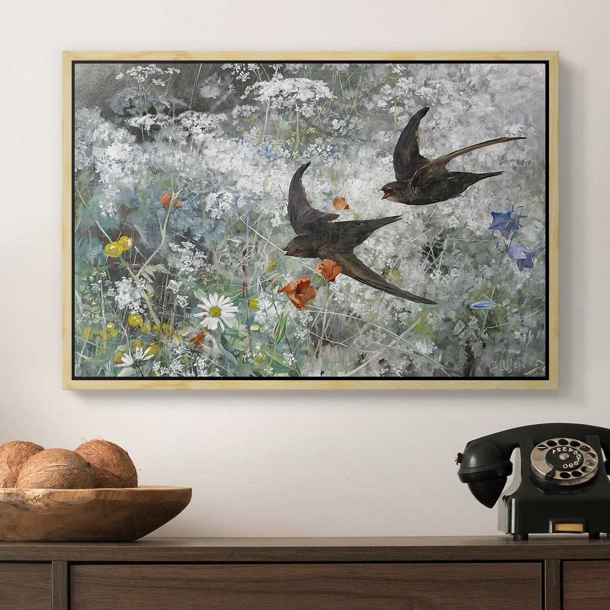 Common Swifts, 1886 by Bruno Liljefors in a natural wood floater framed canvas displayed above a console table in a hallway, featuring an impressionist wildlife scene capturing birds in motion.