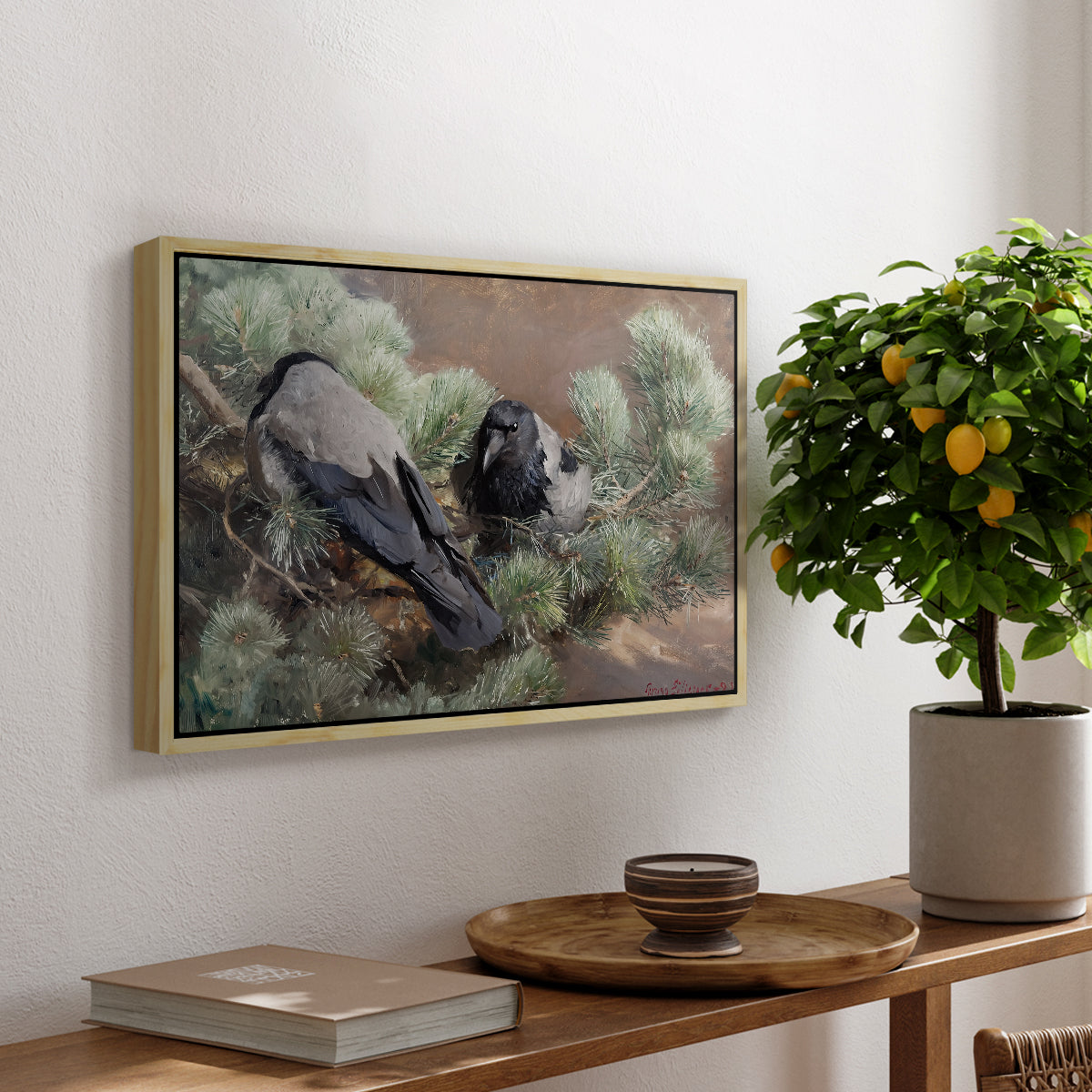 Hooded Crows (Kråkor), 1891 by Bruno Liljefors, presented in a natural wood floater framed canvas featuring two crows perched on ground among grass and earth tones, displayed above a hallway console table.
