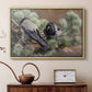 Natural wood floater framed canvas featuring a realistic scene of crows interacting on grassy terrain, displayed above a cabinet in a soft-toned living room.