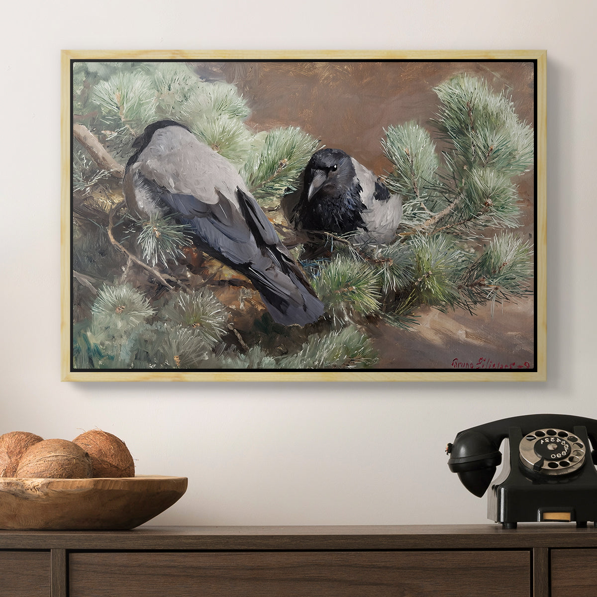 Hooded Crows (Kråkor), 1891 by Bruno Liljefors in a natural wood floater framed canvas displayed above a console table in a hallway, featuring a wildlife painting of dark birds against muted landscape.