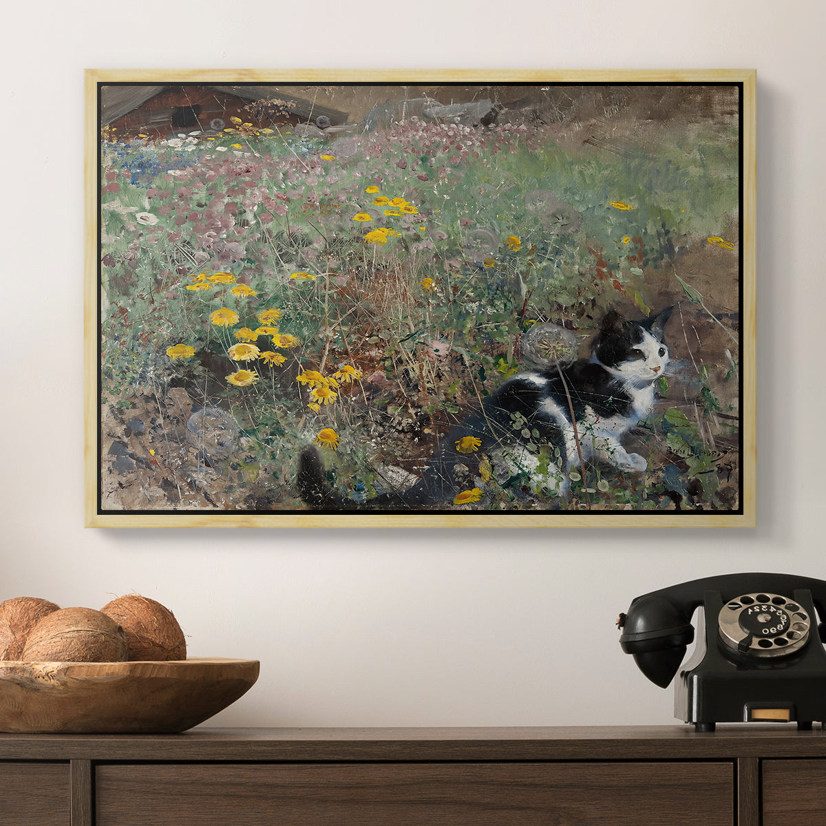 Cat on a Flowery Meadow, 1887 by Bruno Liljefors in a natural wood floater framed canvas displayed above a console table in a hallway, featuring a naturalistic depiction of cat in blooming countryside setting.