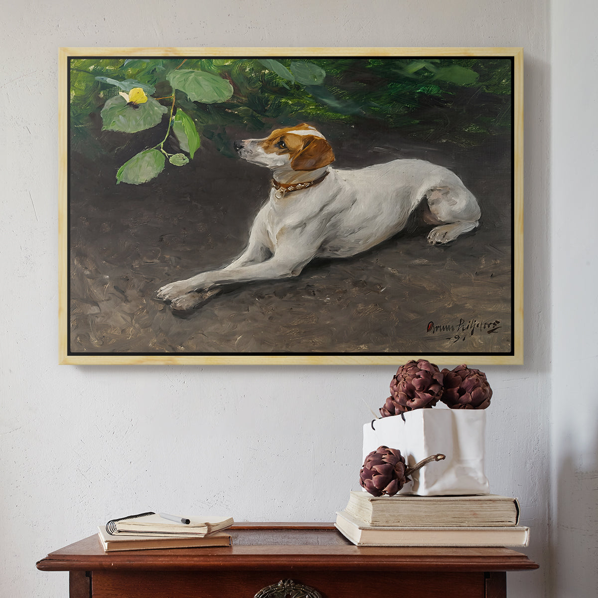 Natural wood floater framed canvas featuring Portrait of a Dog, 1891 by Bruno Liljefors above an entryway table in a minimalist foyer.