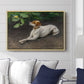 Portrait of a Dog, 1891 by Bruno Liljefors displayed above a sofa in a living room in a natural wood floater frame, featuring a realistic portrait of a resting dog with attentive expression.