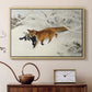 Natural wood floater framed canvas featuring a red fox crossing snow-covered ground under pale sky, displayed above a cabinet in a soft-toned living room.