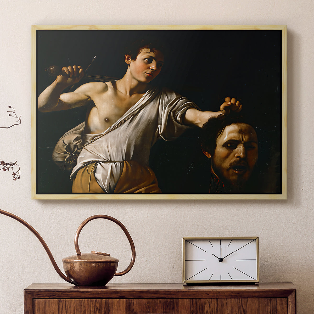 Natural wood floater framed canvas featuring a Baroque depiction of youth holding severed head in shadowy setting, displayed above a cabinet in a soft-toned living room.