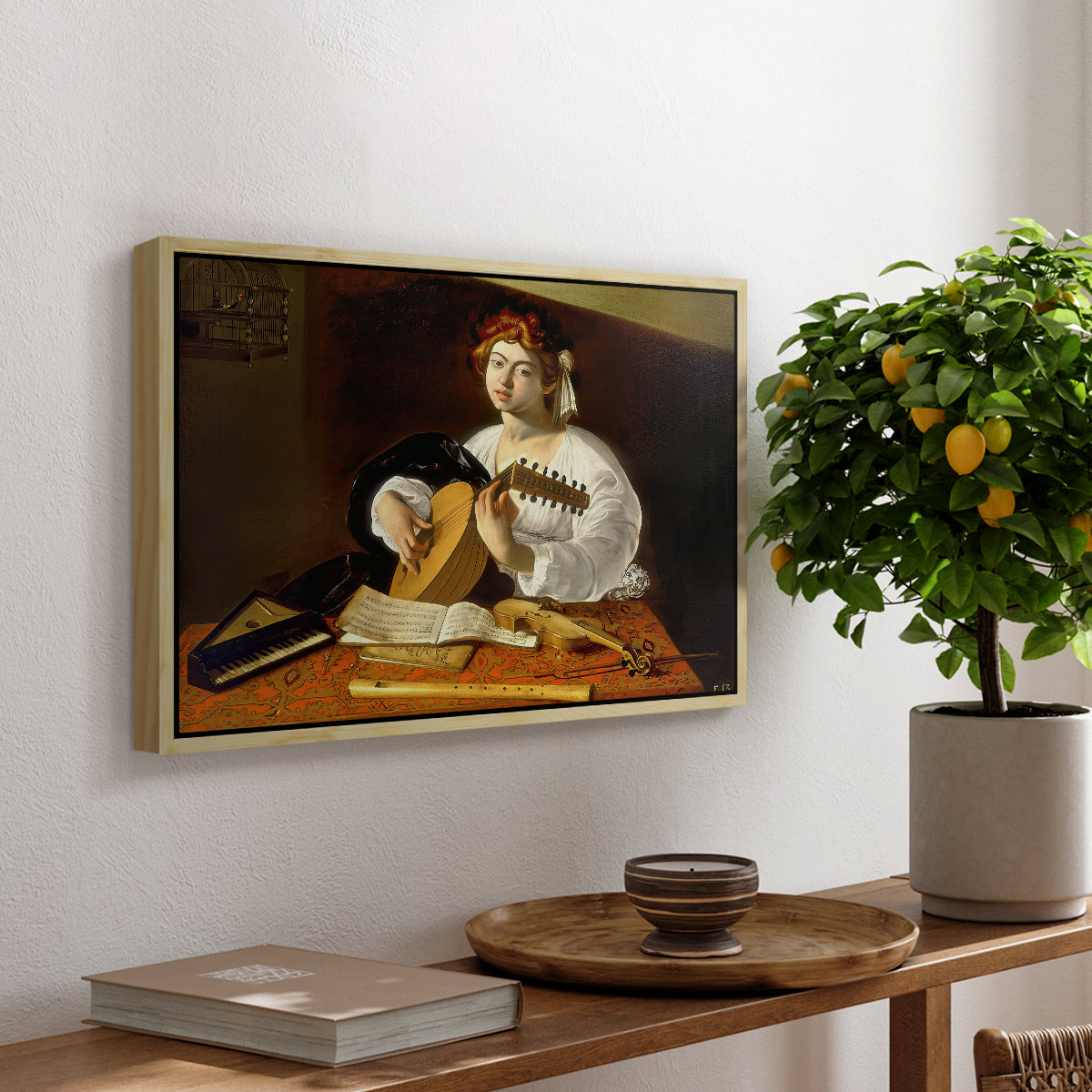 The Lute Player (Wildenstein Version), c. 1596 by Caravaggio, presented in a natural wood floater framed canvas featuring a young man playing lute surrounded by sheet music and still life objects, displayed above a hallway console table.