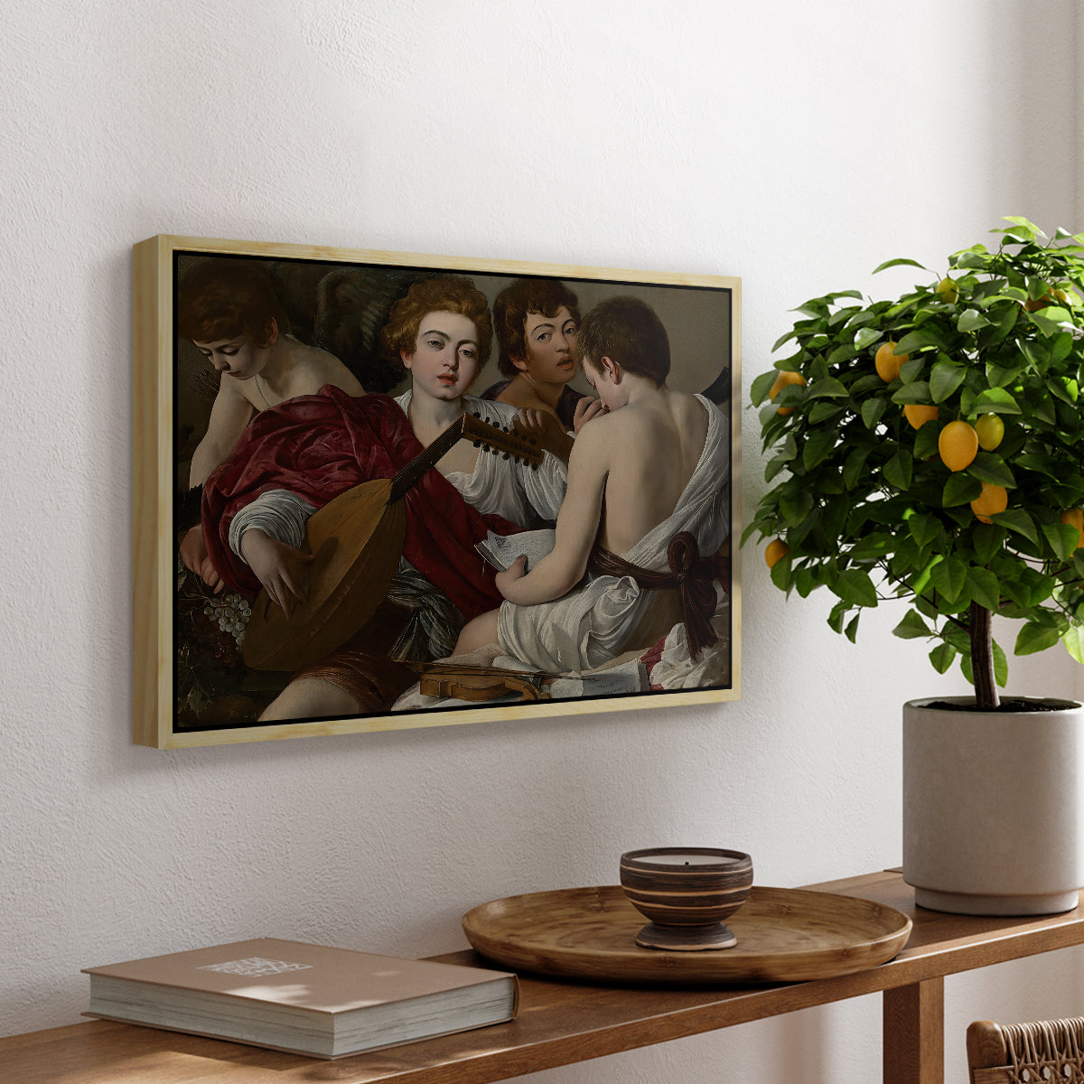 The Musicians, c. 1595 by Caravaggio, presented in a natural wood floater framed canvas featuring a group of young men gathered together playing music with instruments, displayed above a hallway console table.