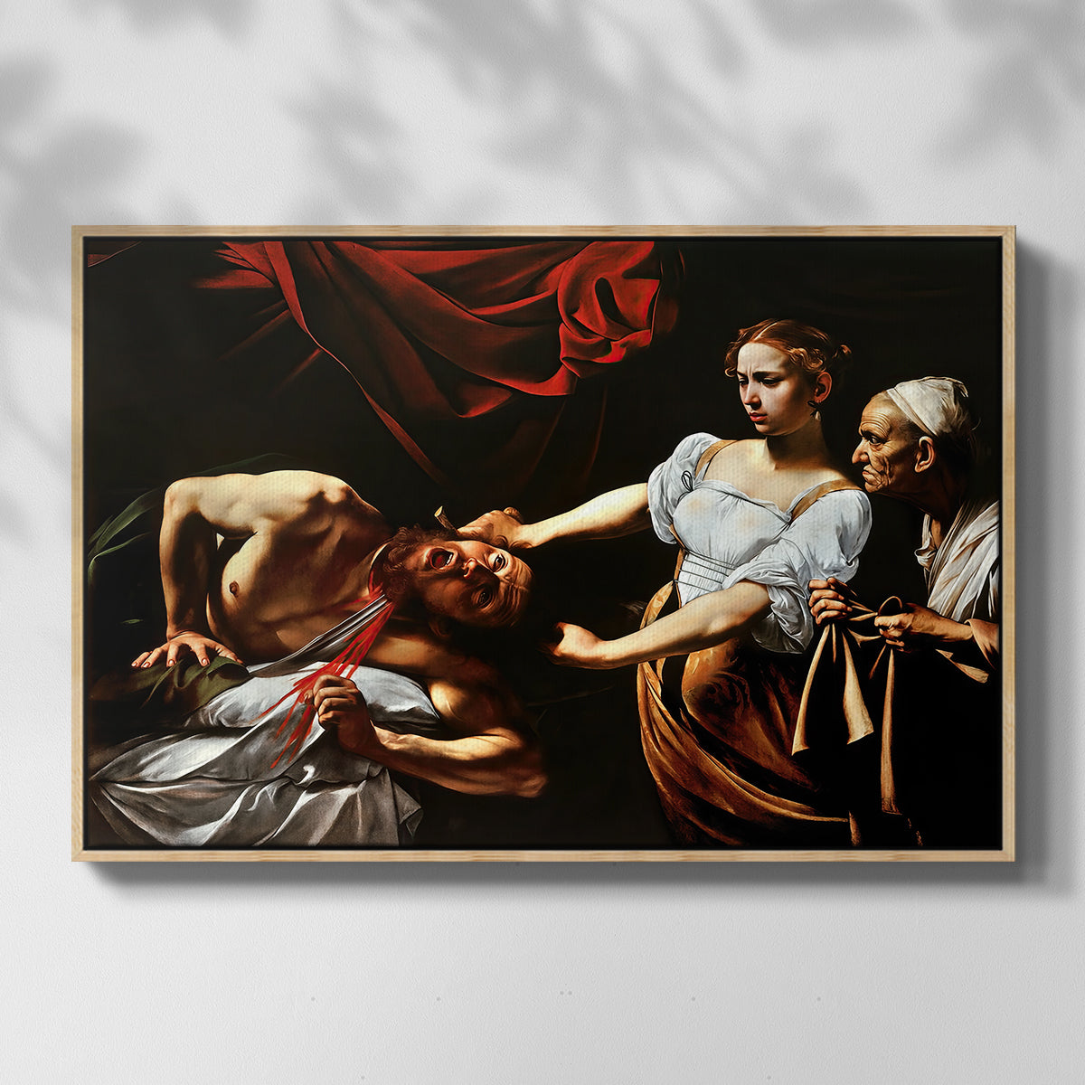 Front view of Judith Beheading Holofernes, c. 1599 by Caravaggio in a natural wood floater framed canvas.