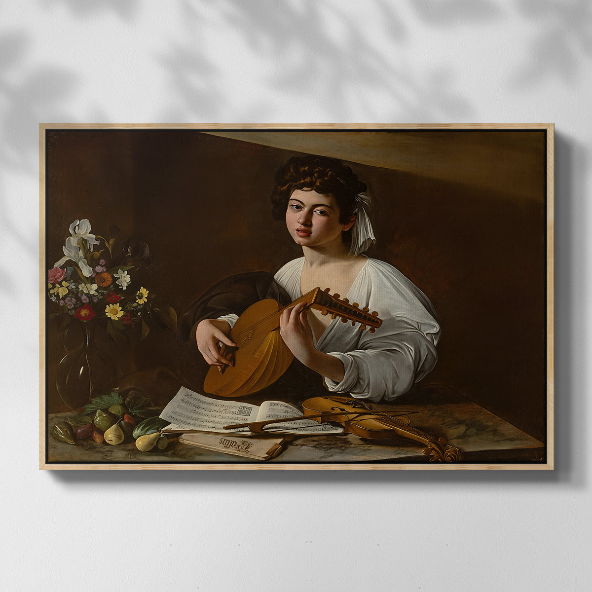 Front view of The Lute Player (Hermitage Version), c. 1596 by Caravaggio in a natural wood floater framed canvas.