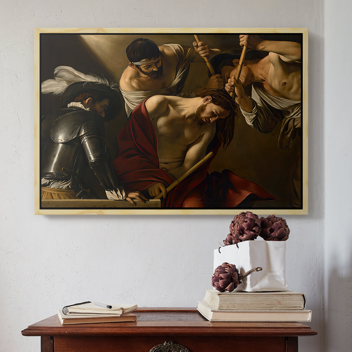 Natural wood floater framed canvas featuring The Crowning with Thorns (Vienna Version), c. 1602-1604 by Caravaggio above an entryway table in a minimalist foyer.
