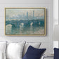 Waterloo Bridge, Gray Weather, 1900 by Claude Monet displayed above a sofa in a living room in a natural wood floater frame, featuring an impressionist cityscape with bridge fading into fog over water.
