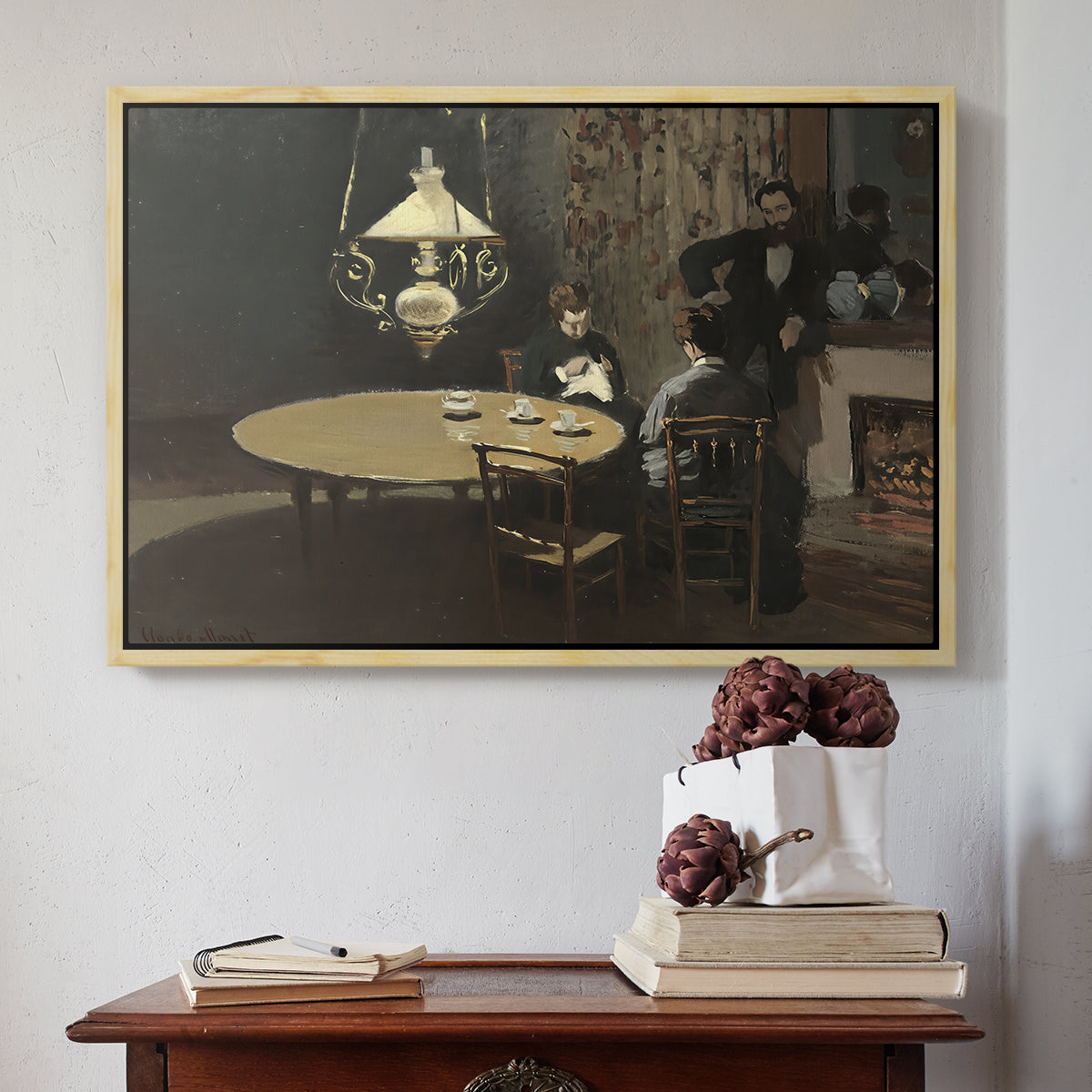 Natural wood floater framed canvas featuring Interior, after Dinner, 1868-1869 by Claude Monet above an entryway table in a minimalist foyer.