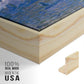 Close-up of the natural wood floater frame corner and gallery wrapped canvas construction.